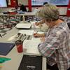 Thumbnail of image 'Student practicing monoline Roman letters'